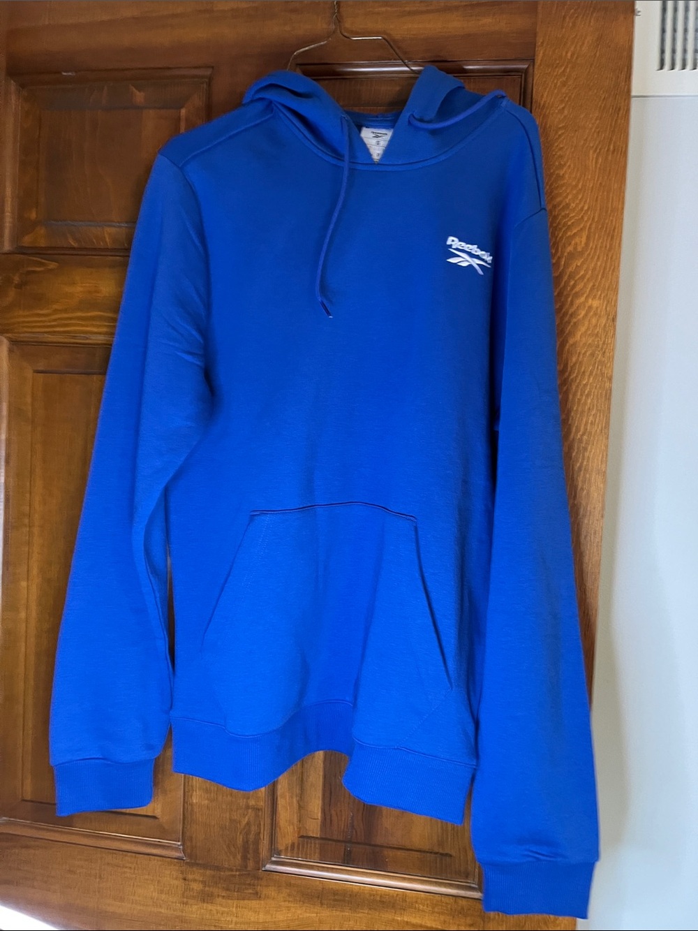 Reebok men’s small hoodie with kangaroo pocket in front Blue